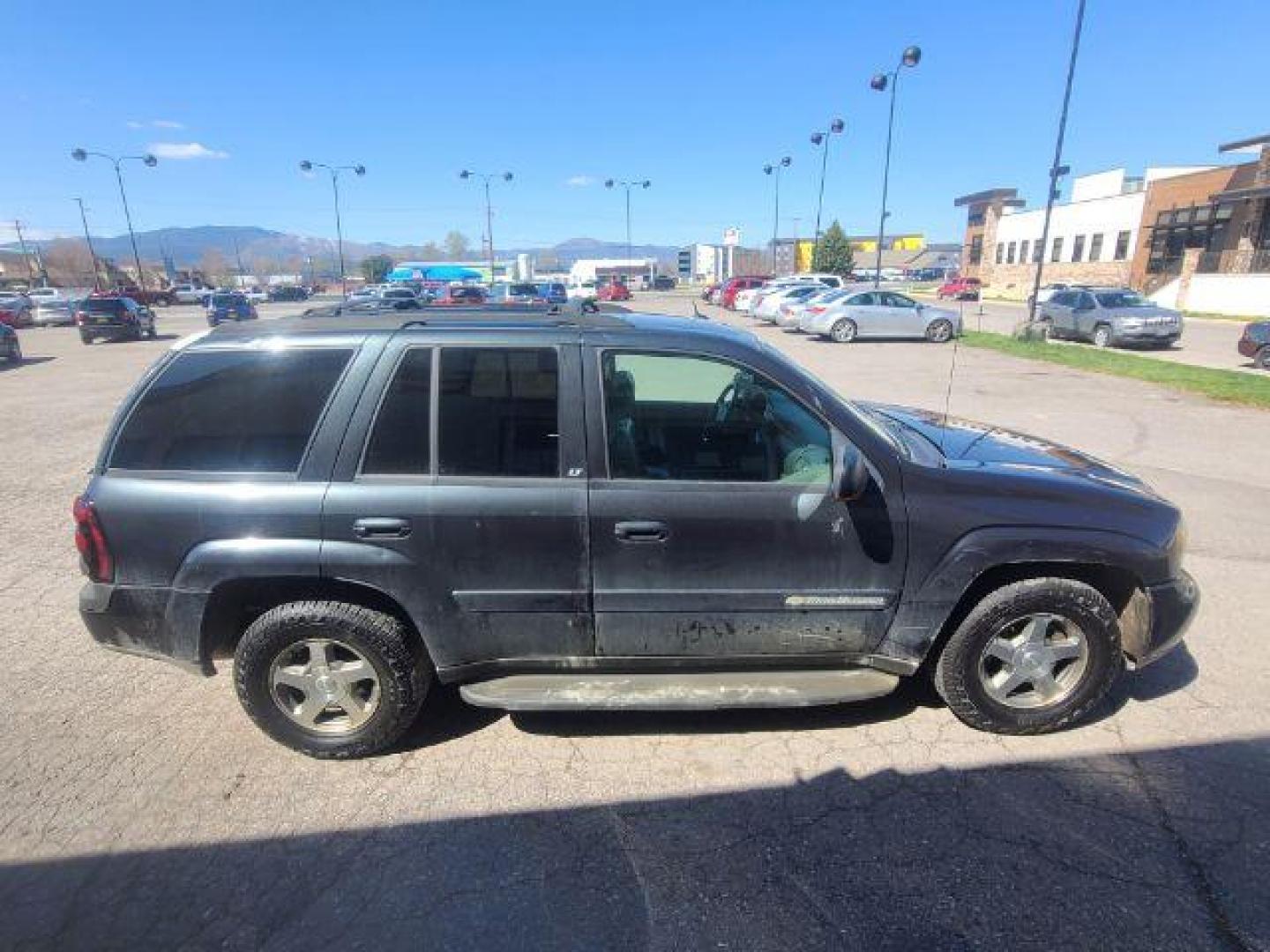 2004 Dark Gray Metallic Chevrolet TrailBlazer LT 4WD (1GNDT13S342) with an 4.2L L6 DOHC 24V engine, 4-Speed Automatic transmission, located at 1800 West Broadway, Missoula, 59808, (406) 543-1986, 46.881348, -114.023628 - Photo#2