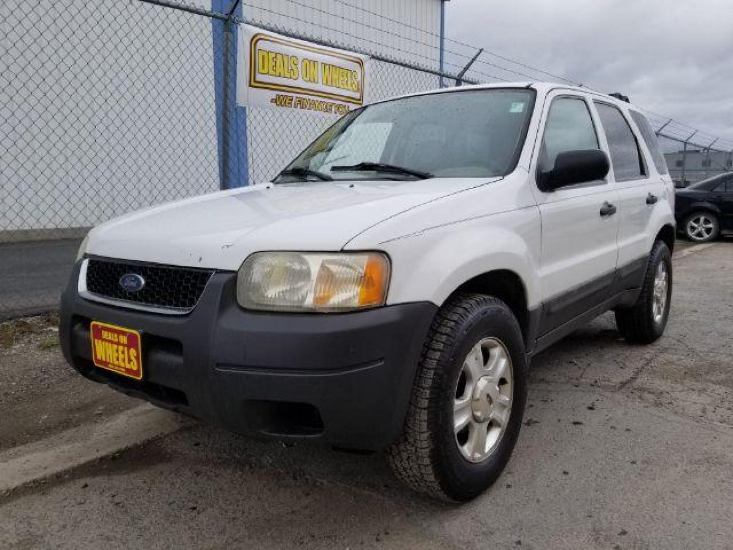 2004 Oxford White Ford Escape XLT 4WD (1FMYU93114D) with an 3.0L V6 DOHC 24V engine, 4-Speed Automatic transmission, located at 1821 N Montana Ave., Helena, MT, 59601, 0.000000, 0.000000 - Photo#0