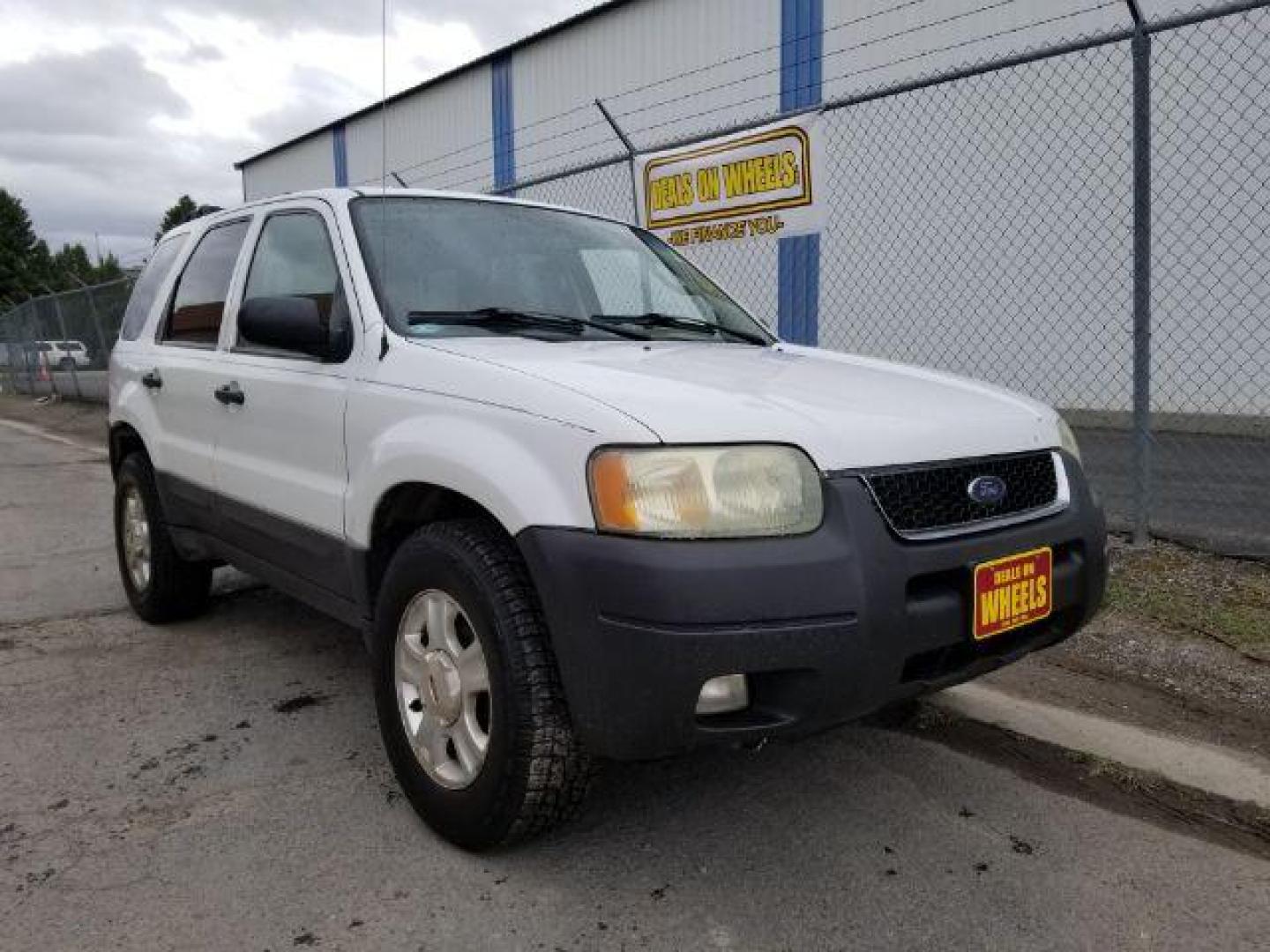 2004 Oxford White Ford Escape XLT 4WD (1FMYU93114D) with an 3.0L V6 DOHC 24V engine, 4-Speed Automatic transmission, located at 1821 N Montana Ave., Helena, MT, 59601, 0.000000, 0.000000 - Photo#6