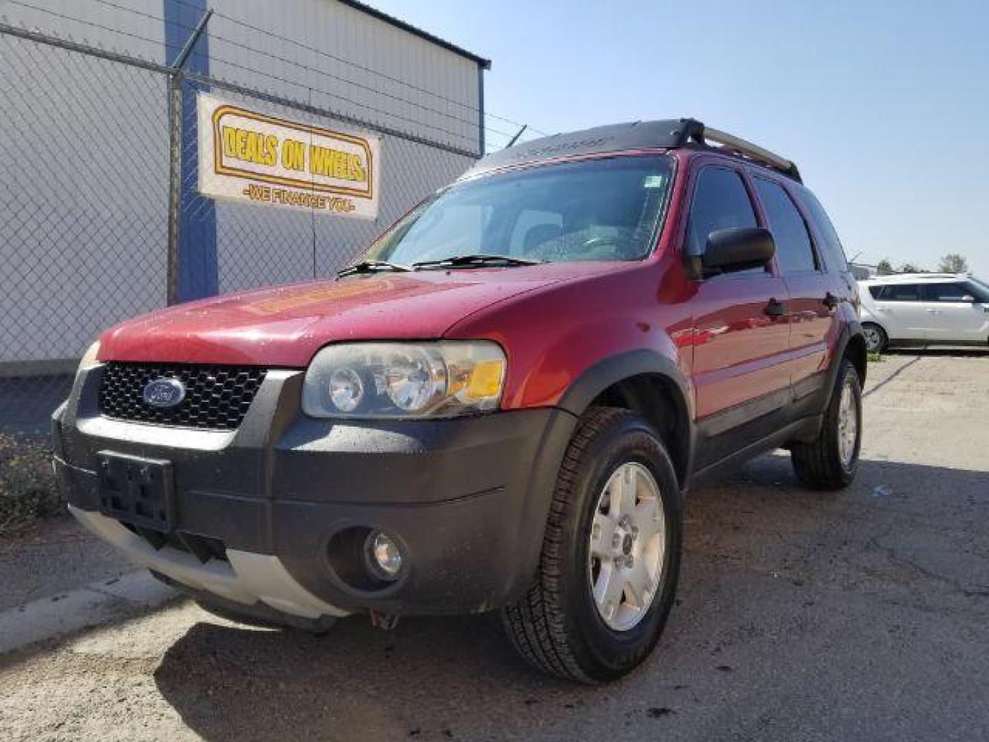 2005 Red Fire Metallic Ford Escape XLT 4WD (1FMYU93125K) with an 3.0L V6 DOHC 24V engine, 4-Speed Automatic transmission, located at 4801 10th Ave S,, Great Falls, MT, 59405, 0.000000, 0.000000 - Photo#0