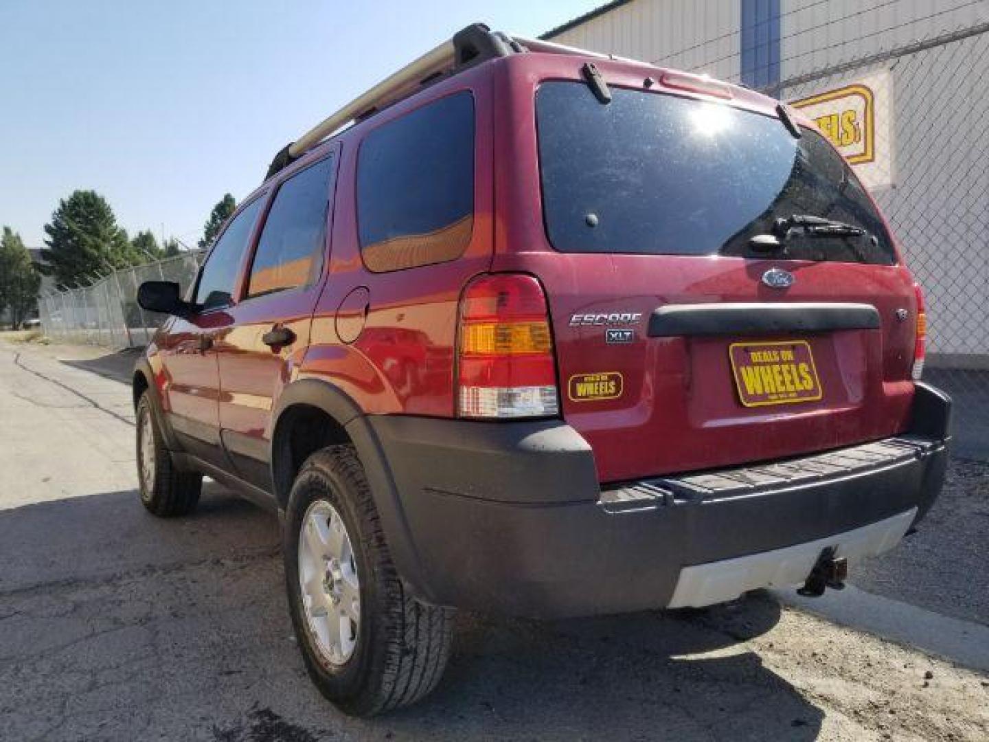 2005 Red Fire Metallic Ford Escape XLT 4WD (1FMYU93125K) with an 3.0L V6 DOHC 24V engine, 4-Speed Automatic transmission, located at 4801 10th Ave S,, Great Falls, MT, 59405, 0.000000, 0.000000 - Photo#3