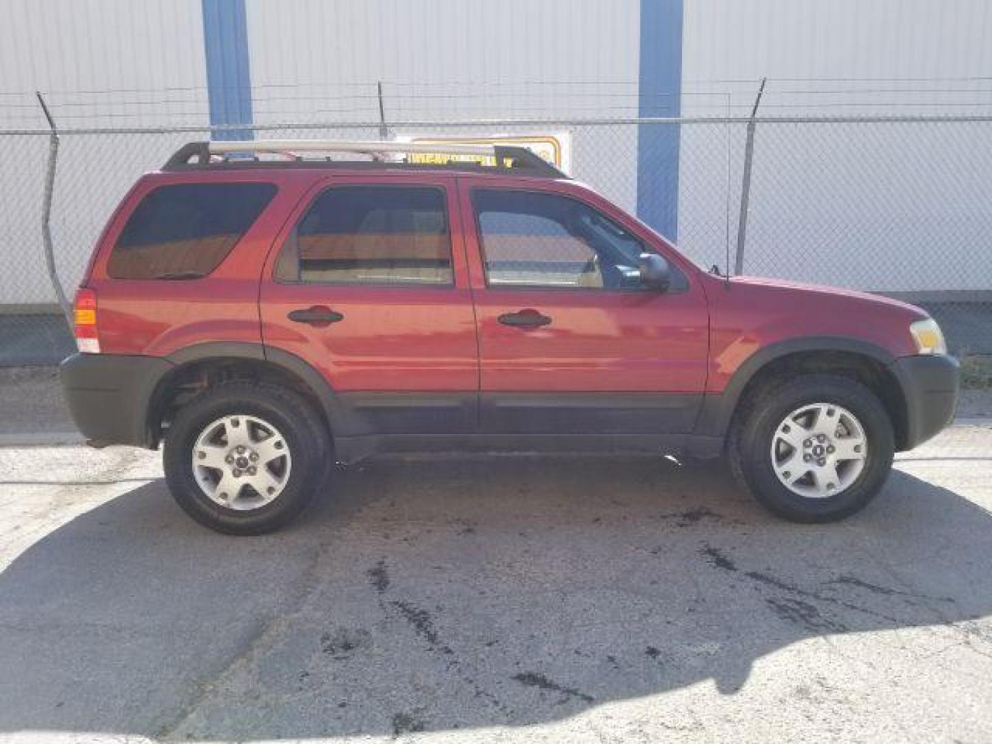 2005 Red Fire Metallic Ford Escape XLT 4WD (1FMYU93125K) with an 3.0L V6 DOHC 24V engine, 4-Speed Automatic transmission, located at 4801 10th Ave S,, Great Falls, MT, 59405, 0.000000, 0.000000 - Photo#5