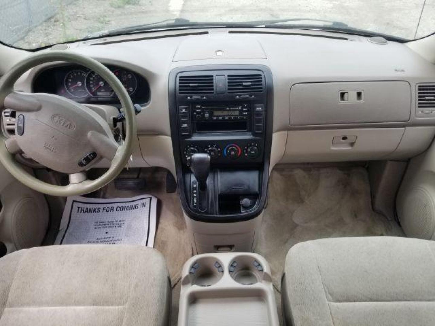 2005 Clear White /Beige Cloth Interior Kia Sedona LX (KNDUP132856) with an 3.5L V6 DOHC 16V engine, 5-Speed Automatic transmission, located at 4801 10th Ave S,, Great Falls, MT, 59405, 0.000000, 0.000000 - Photo#11