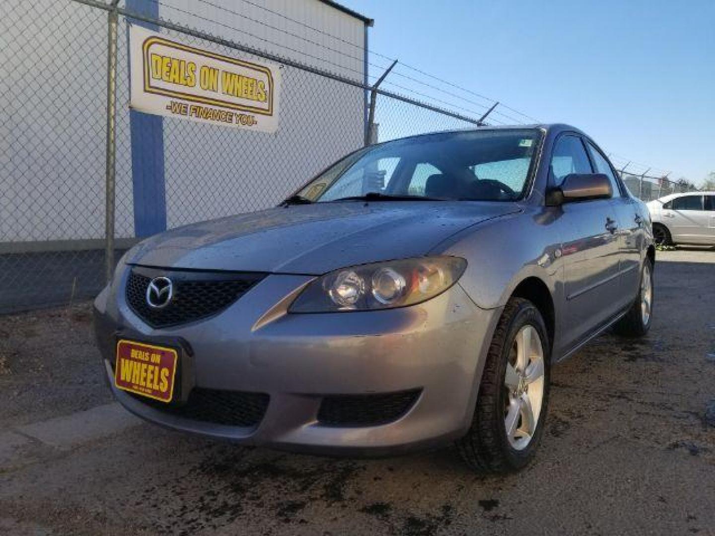 2006 Mazda MAZDA3 i 4-door (JM1BK12FX61) with an 2.0L L4 DOHC 16V engine, located at 601 E. Idaho St., Kalispell, MT, 59901, (406) 300-4664, 0.000000, 0.000000 - Photo#0