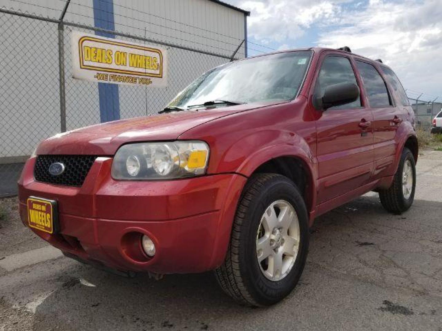 2007 Red Fire Metallic Ford Escape Limited 4WD (1FMYU94127K) with an 3.0L V6 DOHC 24V engine, 4-Speed Automatic transmission, located at 4801 10th Ave S,, Great Falls, MT, 59405, 0.000000, 0.000000 - Photo#0