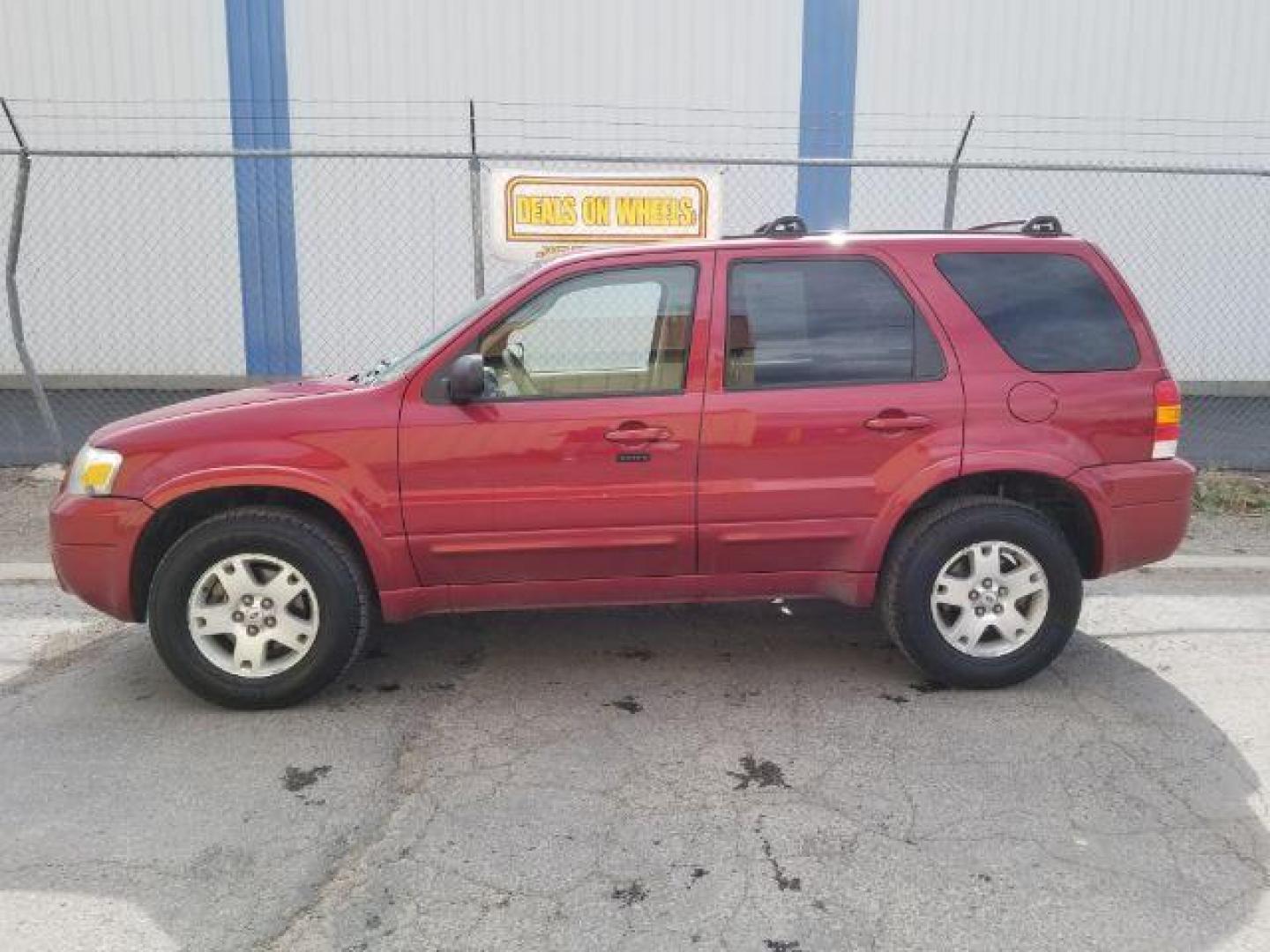 2007 Red Fire Metallic Ford Escape Limited 4WD (1FMYU94127K) with an 3.0L V6 DOHC 24V engine, 4-Speed Automatic transmission, located at 4801 10th Ave S,, Great Falls, MT, 59405, 0.000000, 0.000000 - Photo#3