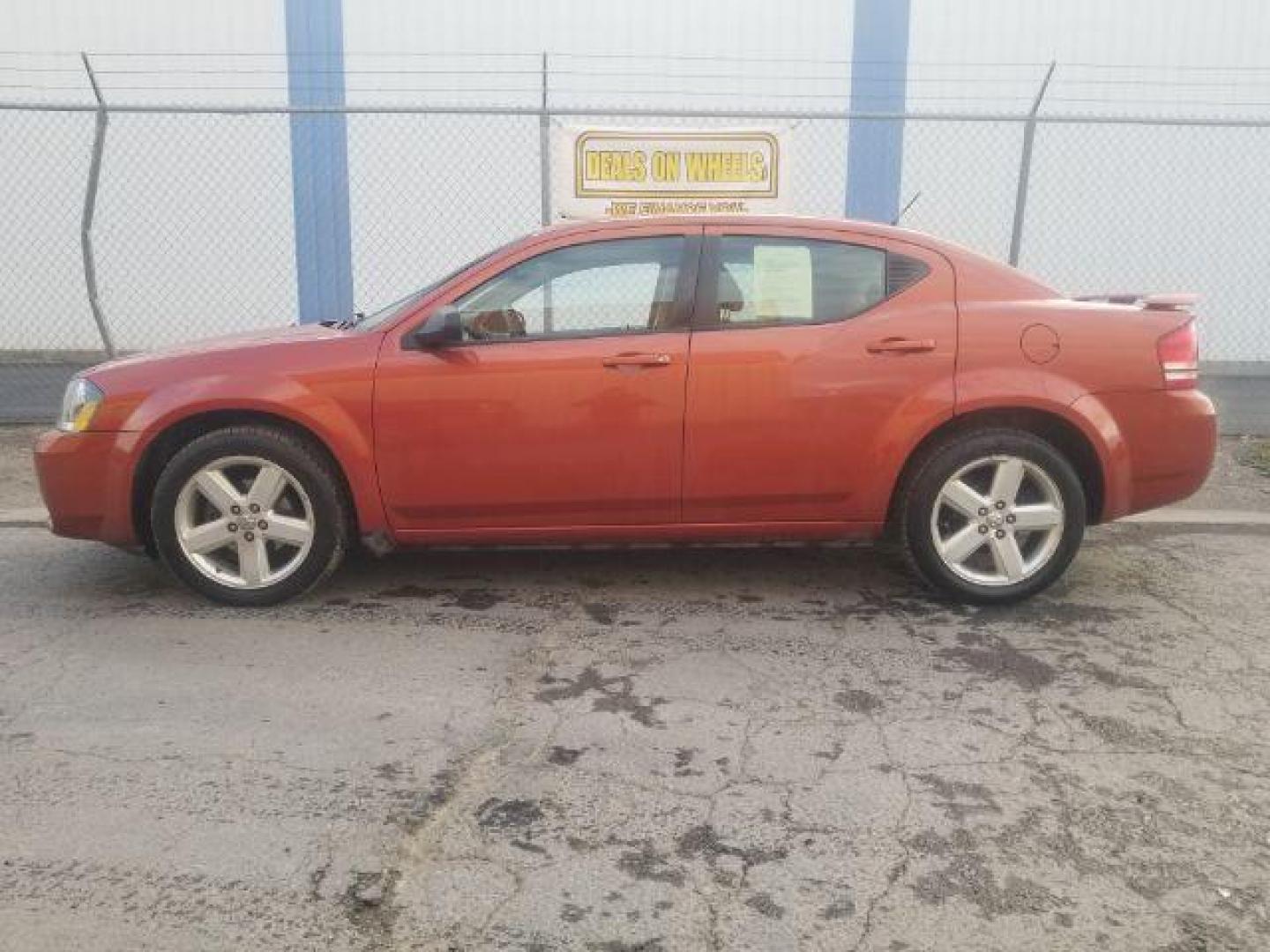 2008 Sunburst Orange Pear Dodge Avenger SXT (1B3LC56R08N) with an 2.7L V6 DOHC 24V FFV engine, 4-Speed Automatic transmission, located at 1800 West Broadway, Missoula, 59808, (406) 543-1986, 46.881348, -114.023628 - Photo#6