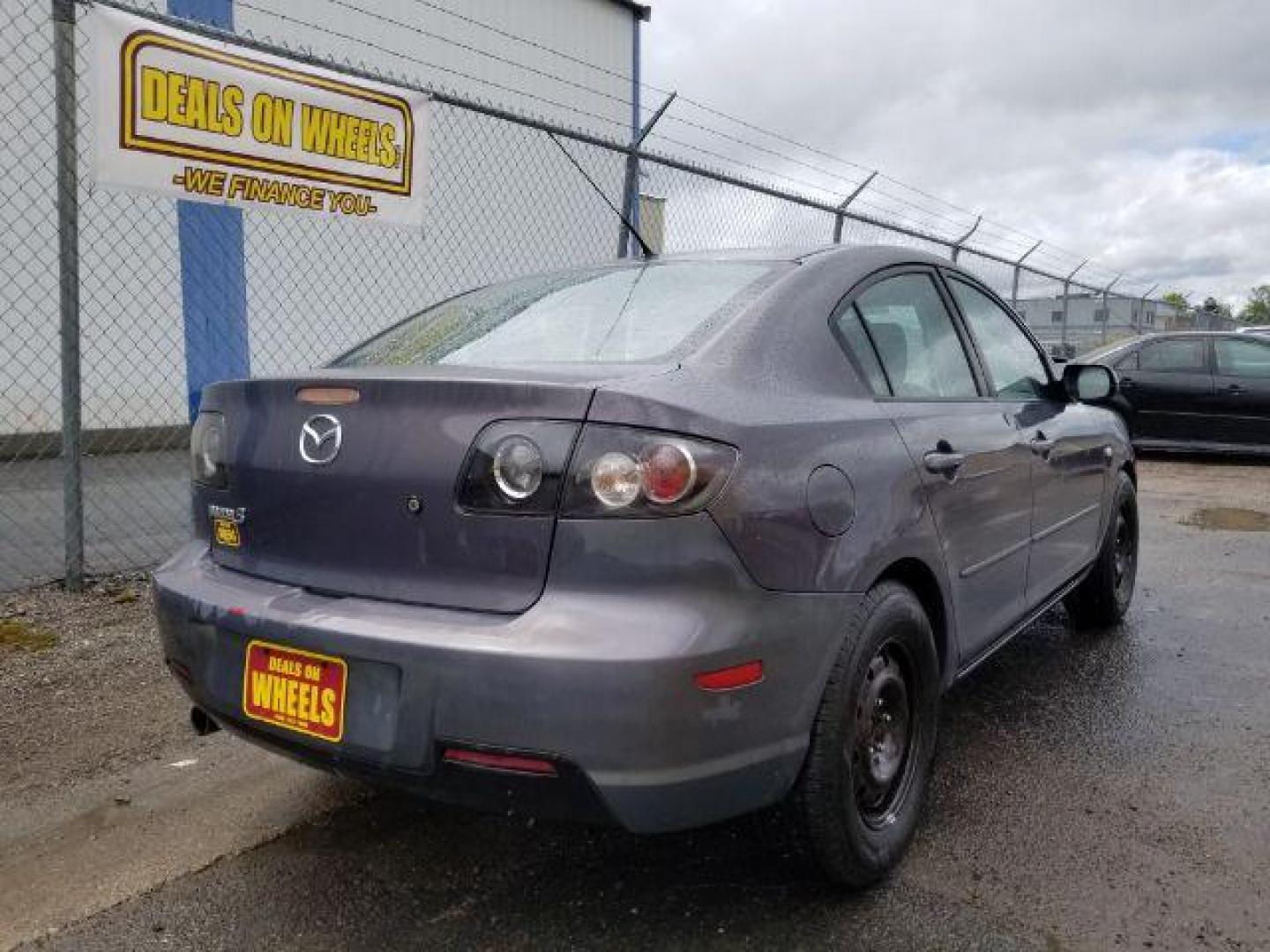 2009 GRAY MAZDA MAZDA3 i Sport 4-Door (JM1BK32G491) , located at 1800 West Broadway, Missoula, 59808, (406) 543-1986, 46.881348, -114.023628 - Photo#4