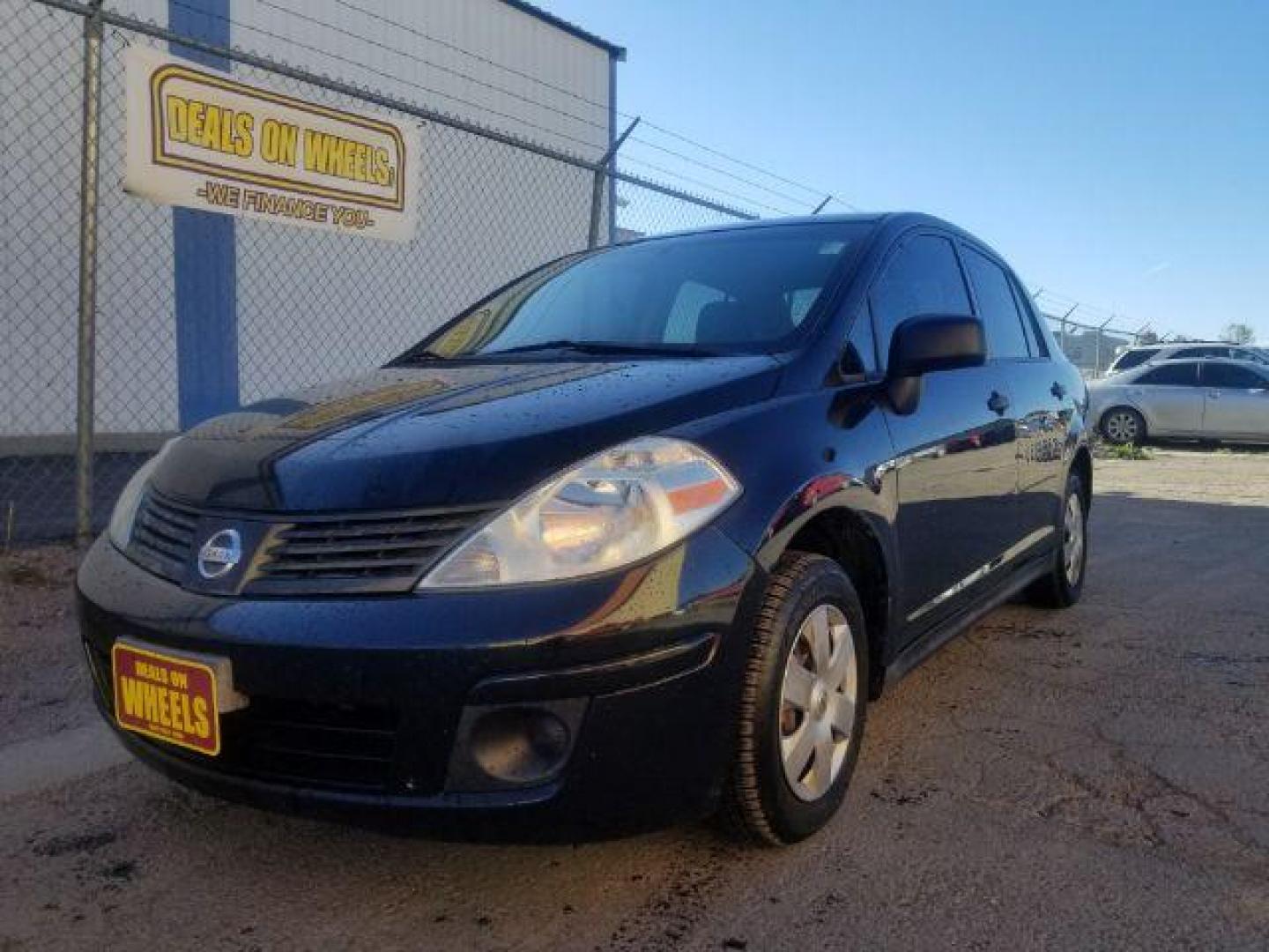 2009 Nissan Versa 1.6 Base Sedan (3N1CC11E79L) with an 1.6L L4 DOHC 16V engine, 5-Speed Manual transmission, located at 601 E. Idaho St., Kalispell, MT, 59901, (406) 300-4664, 0.000000, 0.000000 - Photo#0