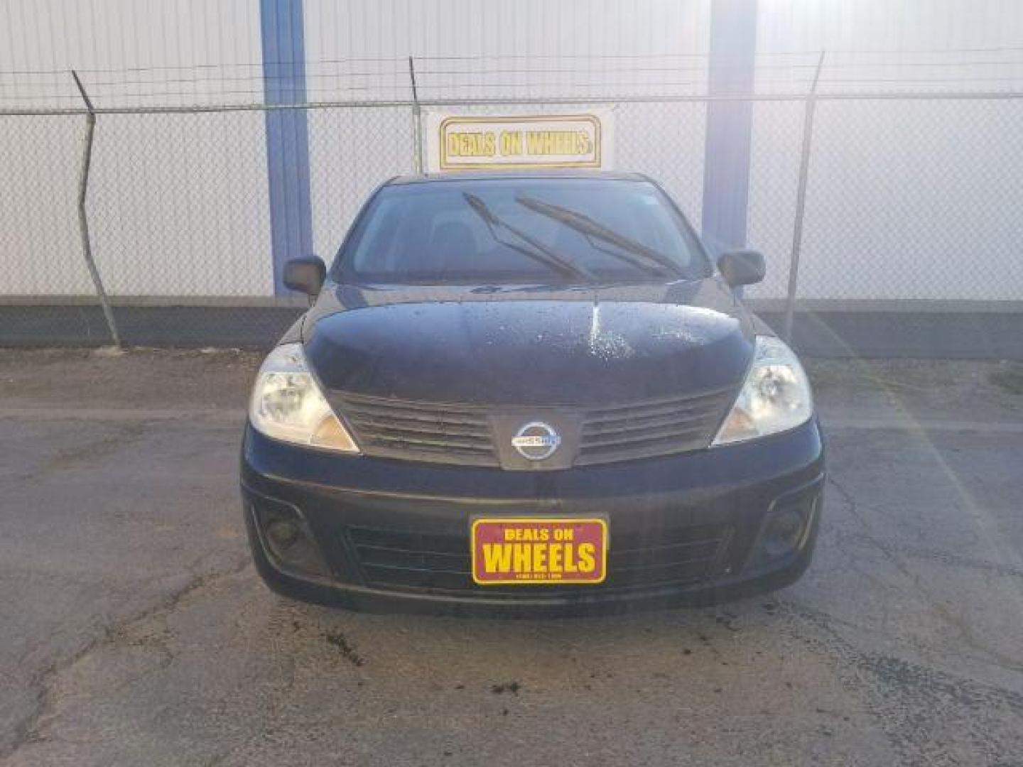 2009 Nissan Versa 1.6 Base Sedan (3N1CC11E79L) with an 1.6L L4 DOHC 16V engine, 5-Speed Manual transmission, located at 601 E. Idaho St., Kalispell, MT, 59901, (406) 300-4664, 0.000000, 0.000000 - Photo#1