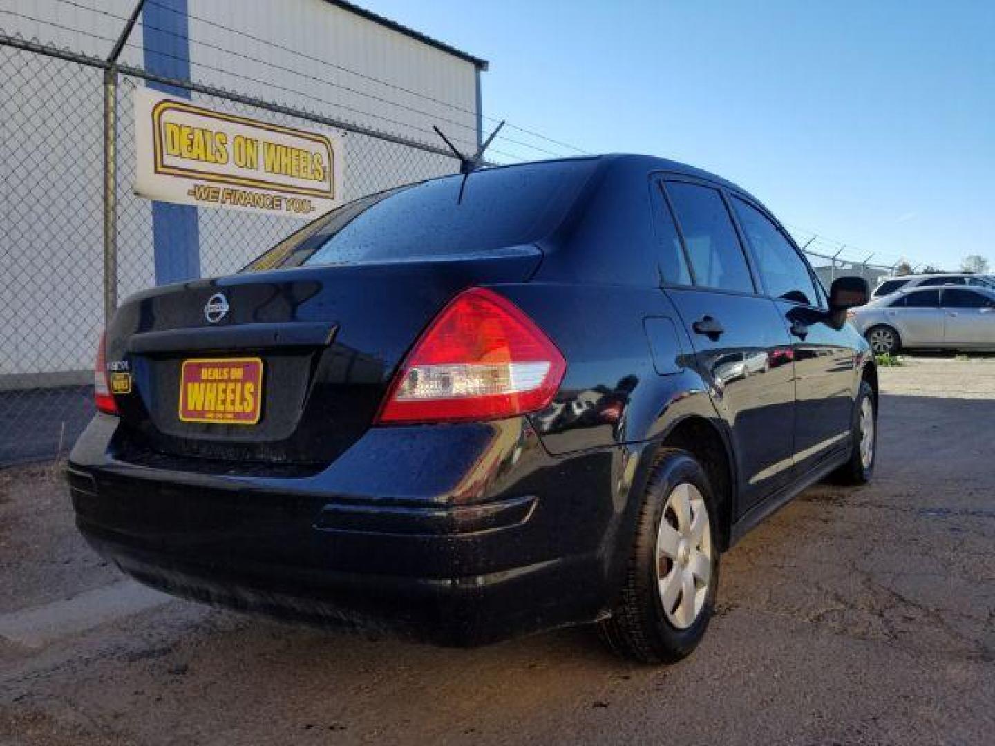 2009 Nissan Versa 1.6 Base Sedan (3N1CC11E79L) with an 1.6L L4 DOHC 16V engine, 5-Speed Manual transmission, located at 601 E. Idaho St., Kalispell, MT, 59901, (406) 300-4664, 0.000000, 0.000000 - Photo#4