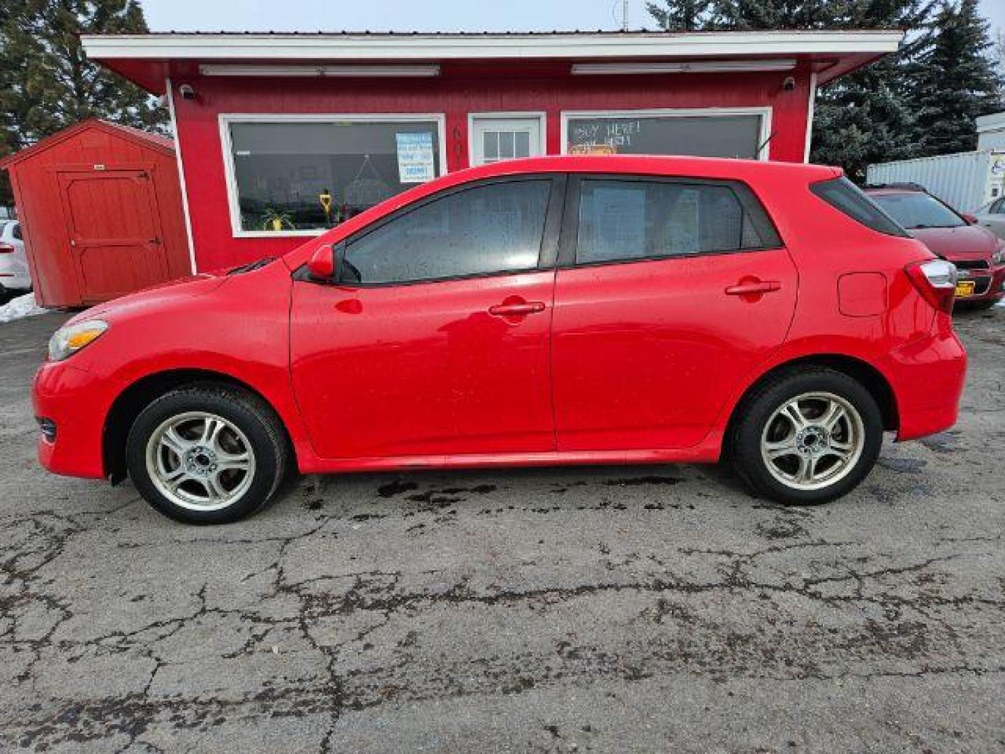 2009 Radiant Red Toyota Matrix Base 5-Speed MT (2T1KU40E09C) with an 1.8L L4 DOHC 16V engine, 5-Speed Manual transmission, located at 601 E. Idaho St., Kalispell, MT, 59901, (406) 300-4664, 0.000000, 0.000000 - Photo#1