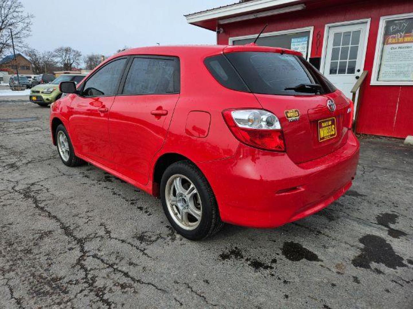 2009 Radiant Red Toyota Matrix Base 5-Speed MT (2T1KU40E09C) with an 1.8L L4 DOHC 16V engine, 5-Speed Manual transmission, located at 601 E. Idaho St., Kalispell, MT, 59901, (406) 300-4664, 0.000000, 0.000000 - Photo#2