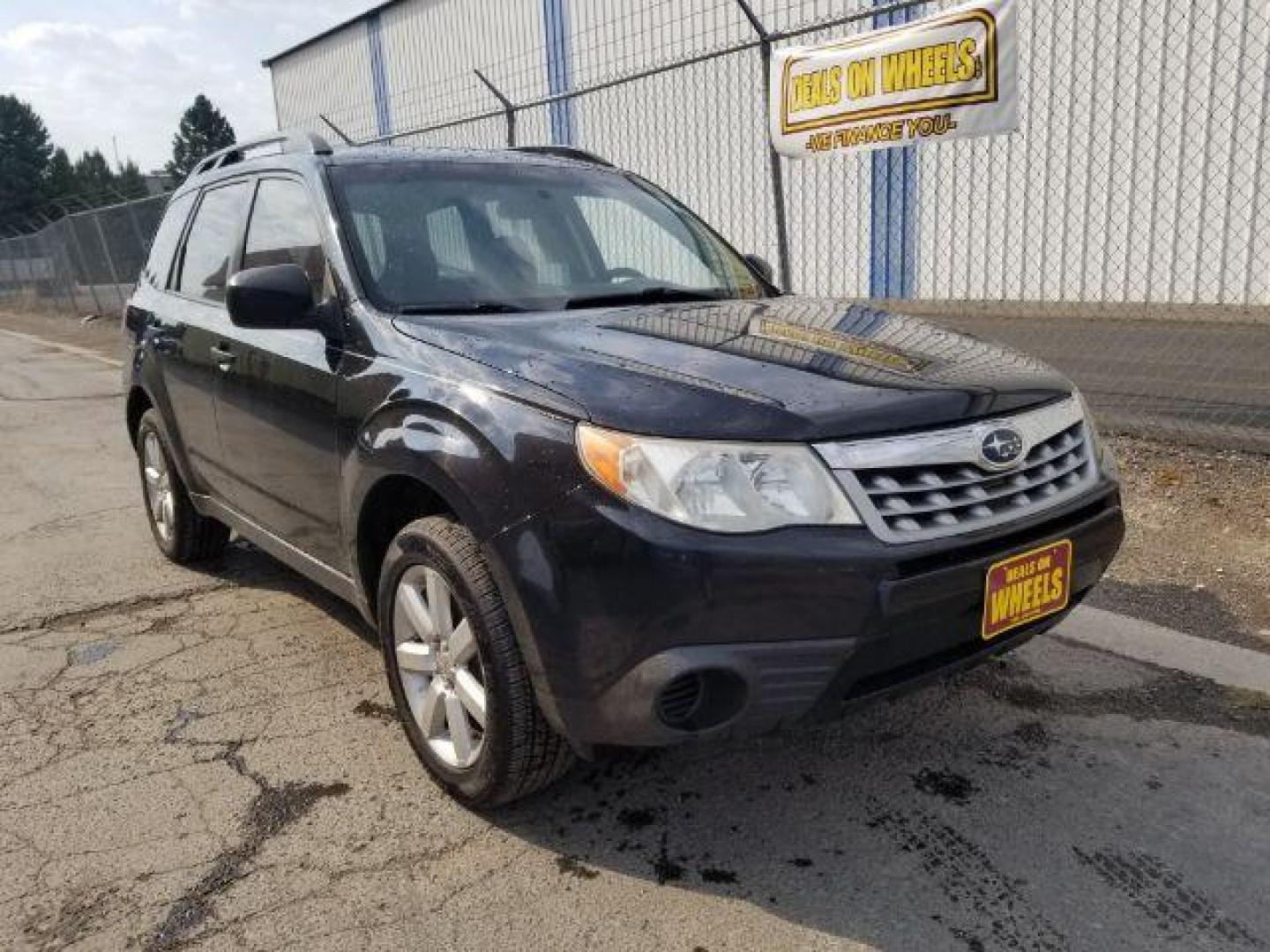 2011 Subaru Forester 2.5X Touring (JF2SHABC4BH) with an 2.5L H4 SOHC 16V engine, 4-Speed Automatic transmission, located at 4047 Montana Ave., Billings, MT, 59101, 45.770847, -108.529800 - Photo#5