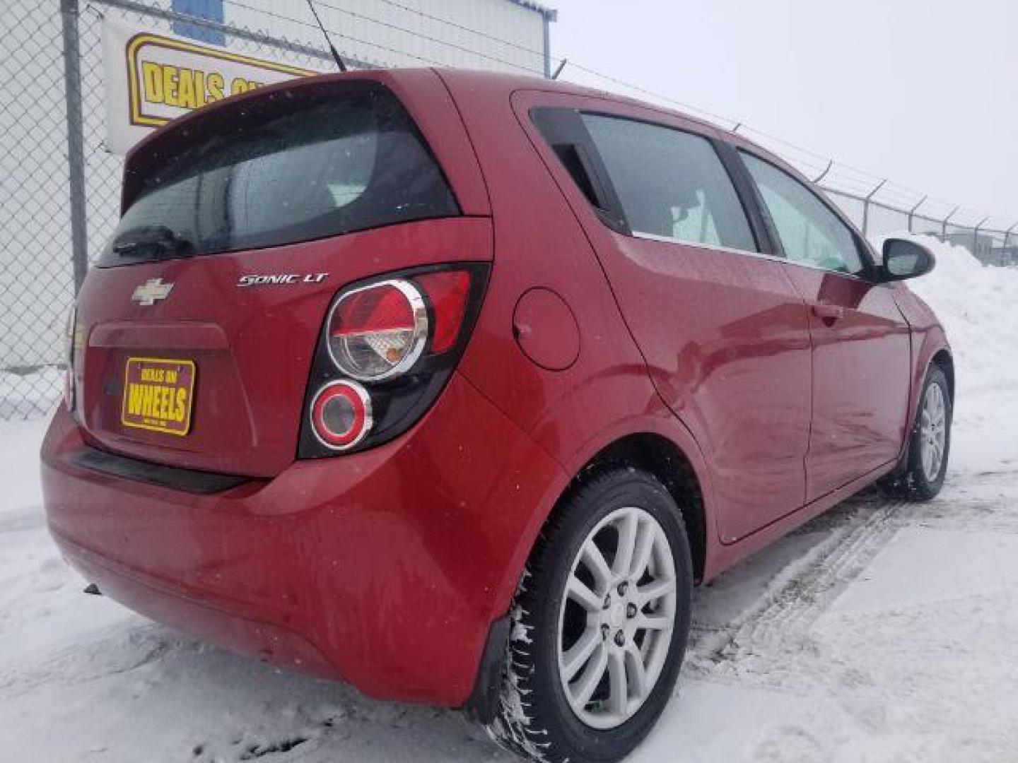 2012 Chevrolet Sonic 2LT 5-Door (1G1JC6SHXC4) with an 1.8L L4 DOHC 24V engine, 6-Speed Automatic transmission, located at 4047 Montana Ave., Billings, MT, 59101, 45.770847, -108.529800 - Photo#4