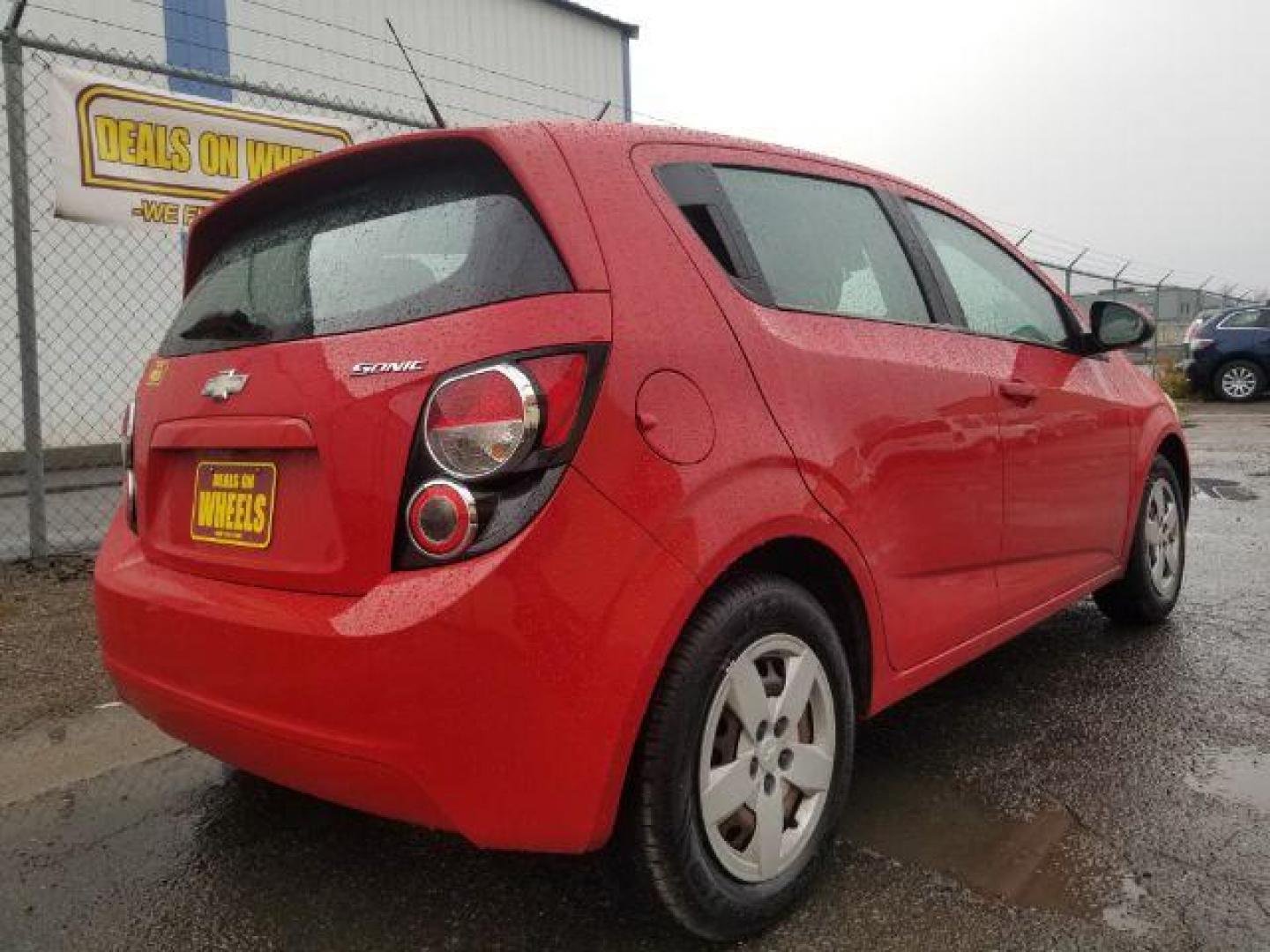 2013 Chevrolet Sonic LS Auto 5-Door (1G1JA6SH6D4) with an 1.8L L4 DOHC 24V engine, 6-Speed Automatic transmission, located at 4047 Montana Ave., Billings, MT, 59101, 45.770847, -108.529800 - Photo#4