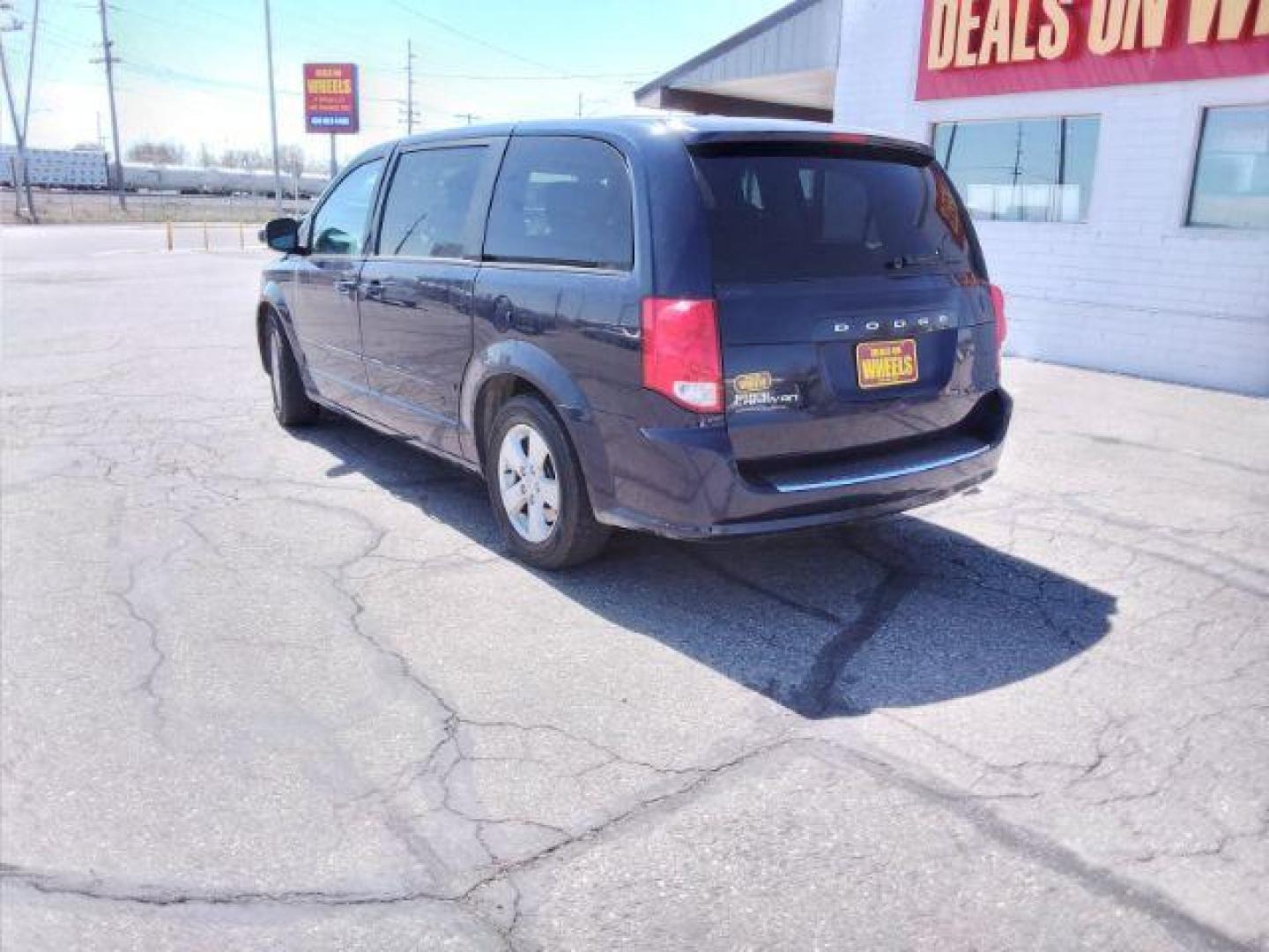 2013 Blue Streak Pearl Dodge Grand Caravan SE (2C4RDGBG5DR) with an 3.6L V6 DOHC 24V engine, 6-Speed Automatic transmission, located at 4047 Montana Ave., Billings, MT, 59101, 45.770847, -108.529800 - Photo#2