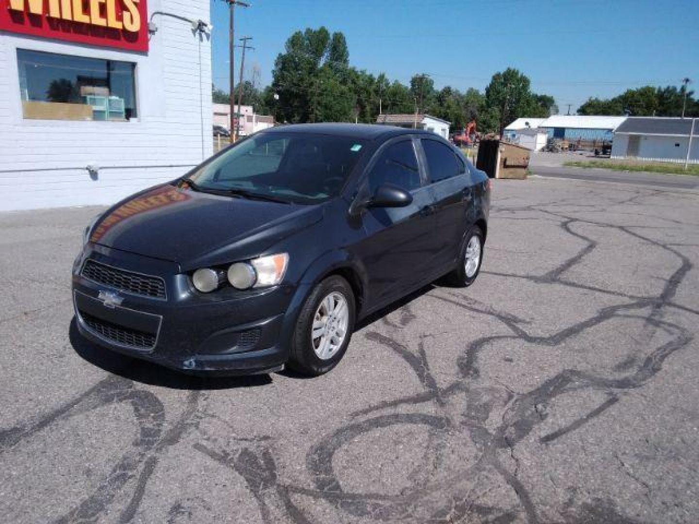 2014 Chevrolet Sonic LT Auto Sedan (1G1JC5SH9E4) with an 1.8L L4 DOHC 24V engine, 6-Speed Automatic transmission, located at 4047 Montana Ave., Billings, MT, 59101, 45.770847, -108.529800 - Photo#0