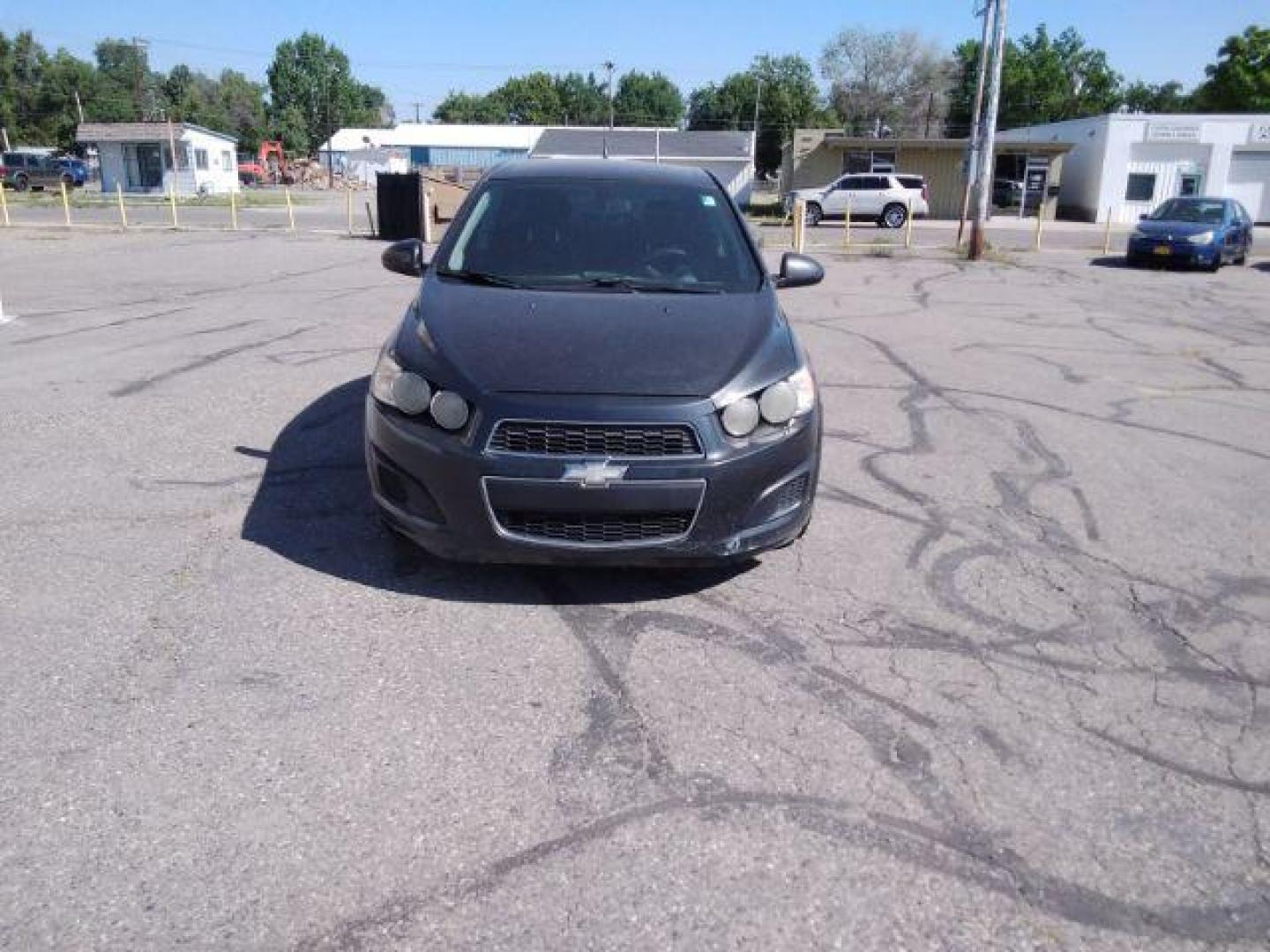 2014 Chevrolet Sonic LT Auto Sedan (1G1JC5SH9E4) with an 1.8L L4 DOHC 24V engine, 6-Speed Automatic transmission, located at 4047 Montana Ave., Billings, MT, 59101, 45.770847, -108.529800 - Photo#2