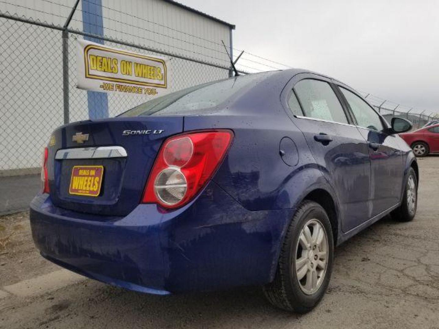 2014 Chevrolet Sonic LT Auto Sedan (1G1JC5SH7E4) with an 1.8L L4 DOHC 24V engine, 6-Speed Automatic transmission, located at 601 E. Idaho St., Kalispell, MT, 59901, (406) 300-4664, 0.000000, 0.000000 - Photo#4