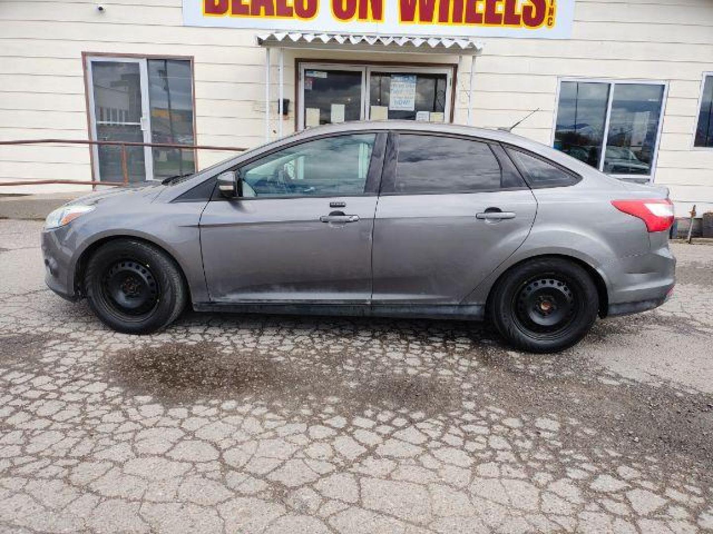 2014 Sterling Gray Metall /Charcoal Black Ford Focus SE Sedan (1FADP3F2XEL) with an 2.0L L4 DOHC 16V engine, located at 1800 West Broadway, Missoula, 59808, (406) 543-1986, 46.881348, -114.023628 - Photo#0