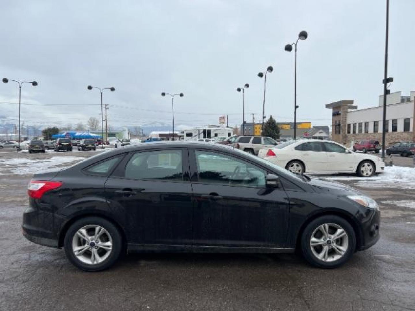 2014 Tuxedo Black Metalli Ford Focus SE Sedan (1FADP3F20EL) with an 2.0L L4 DOHC 16V engine, located at 1800 West Broadway, Missoula, 59808, (406) 543-1986, 46.881348, -114.023628 - Photo#2