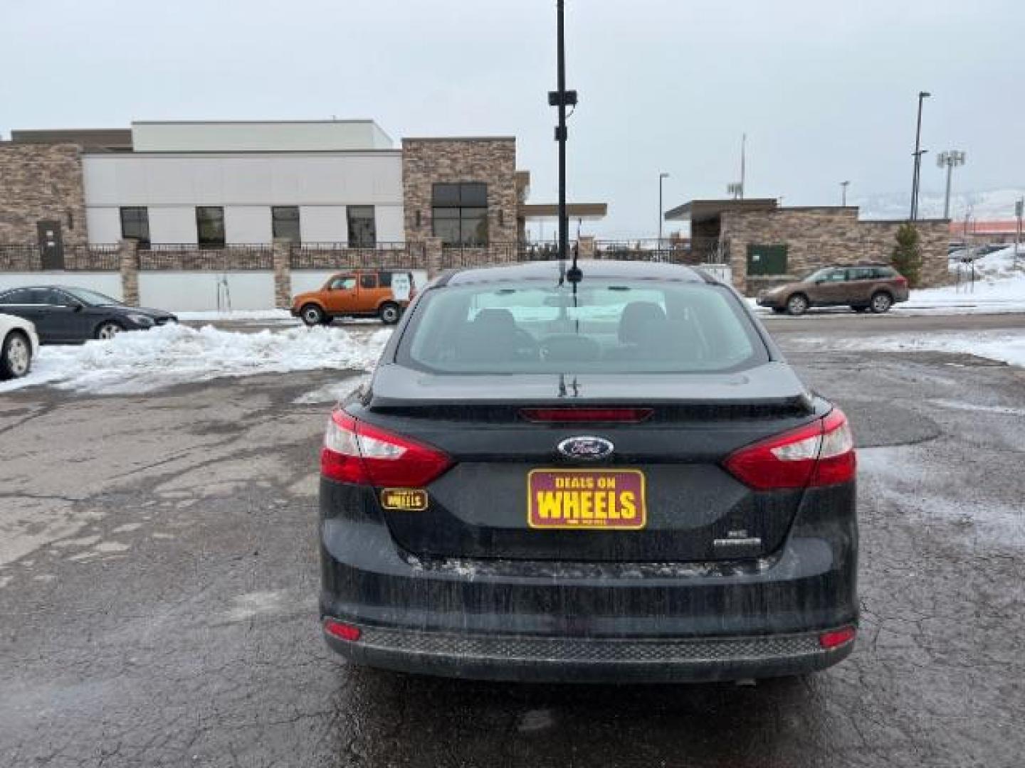 2014 Tuxedo Black Metalli Ford Focus SE Sedan (1FADP3F20EL) with an 2.0L L4 DOHC 16V engine, located at 1800 West Broadway, Missoula, 59808, (406) 543-1986, 46.881348, -114.023628 - Photo#4