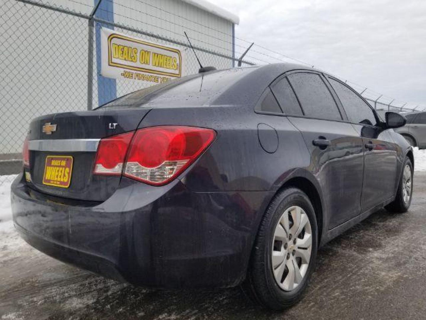 2015 Chevrolet Cruze LS Auto (1G1PA5SG7F7) with an 1.8L L4 DOHC 16V engine, 6-Speed Automatic transmission, located at 4047 Montana Ave., Billings, MT, 59101, 45.770847, -108.529800 - Photo#4