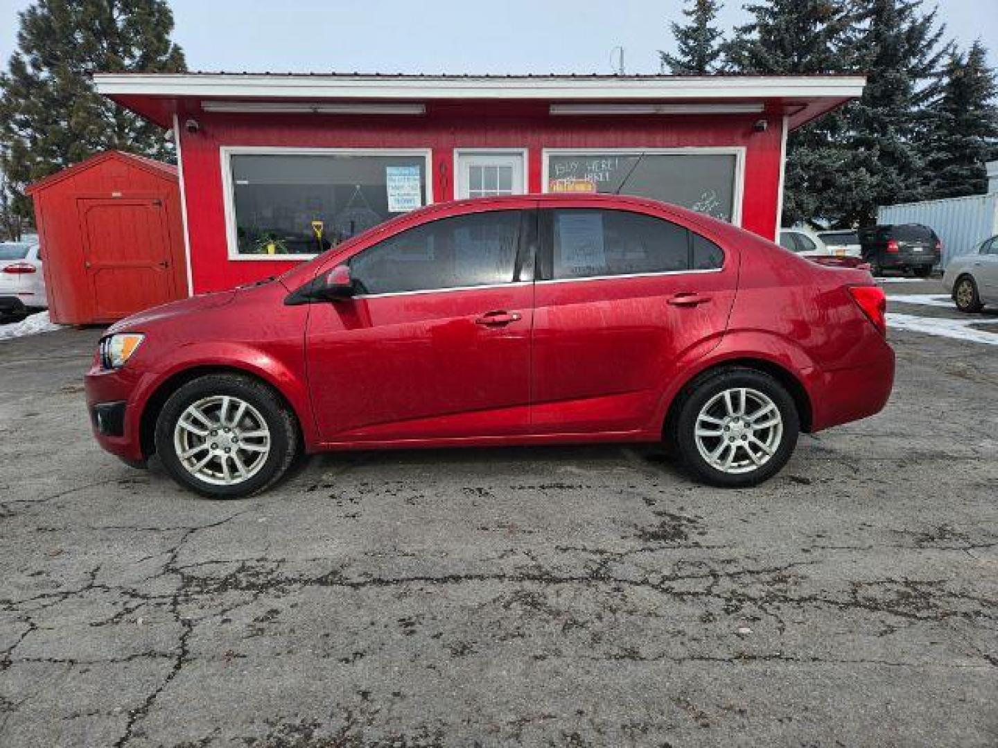 2015 Chevrolet Sonic LT Auto Sedan (1G1JC5SH4F4) with an 1.8L L4 DOHC 24V engine, 6-Speed Automatic transmission, located at 601 E. Idaho St., Kalispell, MT, 59901, (406) 300-4664, 0.000000, 0.000000 - Photo#1